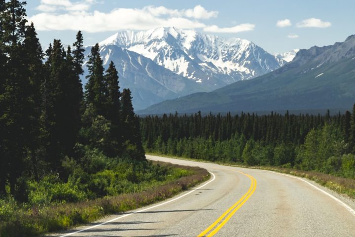 a sign on the side of a mountain road