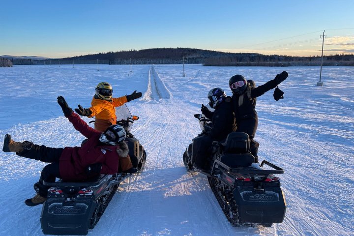 a group of people riding skis on a body of water