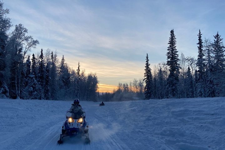 a person riding skis down a snow covered slope
