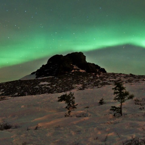 a body of water with a mountain in the background