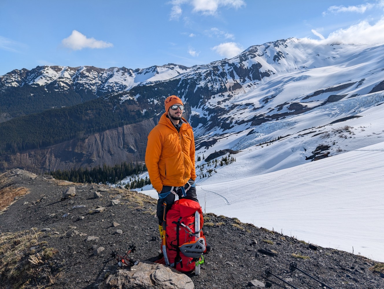 a man standing on top of a snow covered mountain