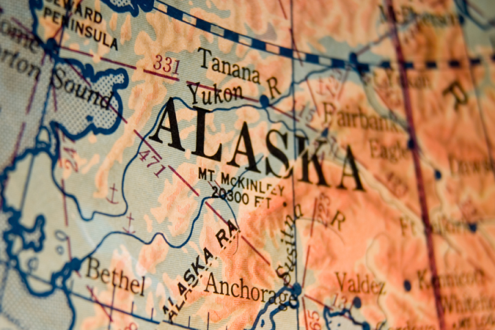 Close-up of a detailed map of Alaska, highlighting cities and the Yukon River.
